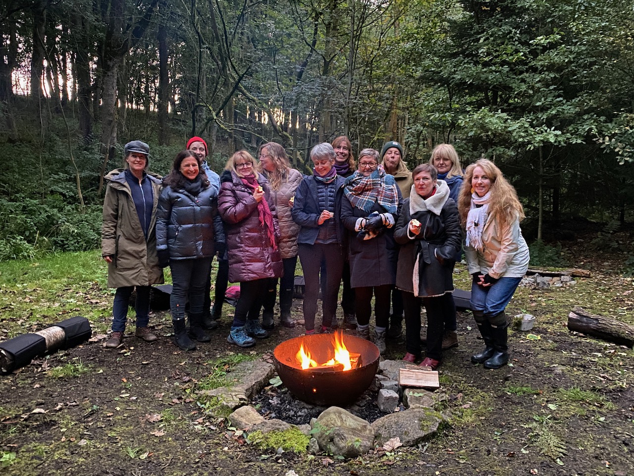 Reboot Retreat women around a fire